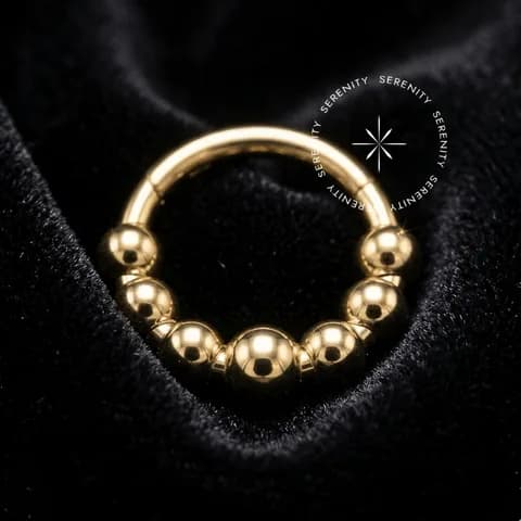 TN1199 - Argola 7 Esferas - Titânio Revestido de Ouro 18k