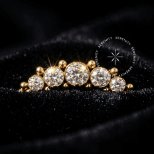 Piercing Cluster Esferas Titânio TN1542 cravejado com zircônias cristalinas em titânio revestido de ouro 18k.