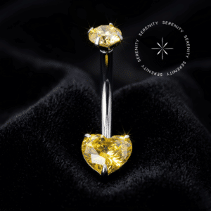 Piercing umbigo titânio navel curve com zircônia premium amarelo imperial formato de coração na base e gema redonda superior com sistema de rosca interna para região abdominal.